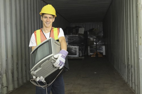 Person using a screen reader to access commercial waste removal service information on a mobile device